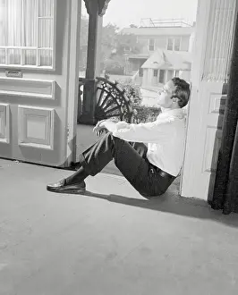 Prints of (Photo by Bettmann Archive/Getty Images) The Iconic Moments Captured: Marlon Brando Sitting at Doorway
