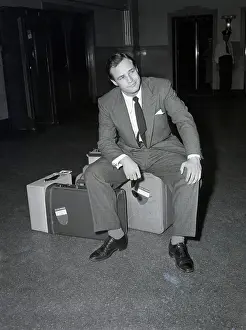 Prints of (Original Caption) 8/5/1953- New York, NY: No passport, no voyage The Iconic Moments Captured: Marlon Brando Stranded With Luggage
