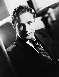 Prints of (Original Caption). Waist-up portrait of Marlon Brando, circa 1952. He is shown at a slight angle, wearing a suit and tie and looking to the side The Iconic Moments Captured: Marlon Brando Waist-up Portrait