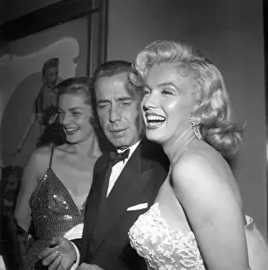 Prints of LOS ANGELES - NOVEMBER 4: Actors Marilyn Monroe and Humphrey Bogart and Lauren Bacall attend the premiere of her movie How To Marry A Millionaire on November 4, 1953 in Los Angeles, California The Essence of Cool: How To Marry A Millionaire Premiere