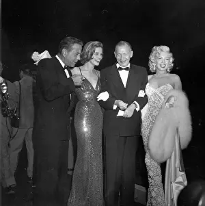 Prints of LOS ANGELES - NOVEMBER 4: Actors Marilyn Monroe, Lauren Bacall and Humphrey Bogart attends the premiere of the movie How To Marry A Millionaire with a guest on November 4, 1953 in Los Angeles The Essence of Cool: How To Marry A Millionaire Premiere