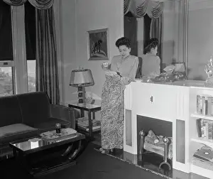 Marva Louis Leaning on Fireplace Mantle