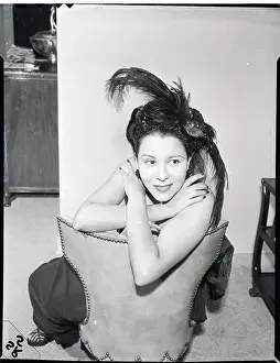 Marva Louis Seated With Arms Crossed