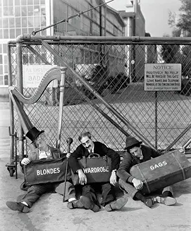 Marx Brothers Sitting Outside Gate