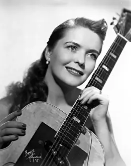 Mary Ford Holding A Guitar