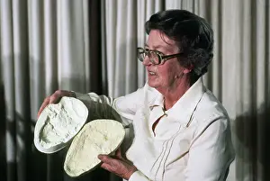 Trail Prints: Mary Leakey Holding a Mold from a 3.6 Million Year Old Footprint
