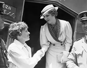 Mary Pickford and Amelia Earhart Shake Hands
