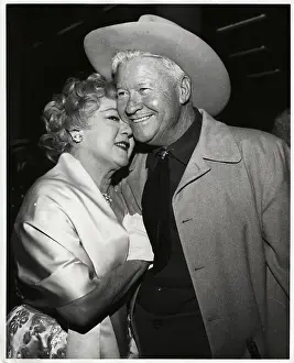 Prints of (Original Caption). It was a backstage reunion for America's sweetheart Mary Pickford and old-timer Jackie Oakie At The Movies: Mary Pickford Embracing Jackie Oakie