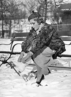 Mary Pickford Putting on Ice Skates
