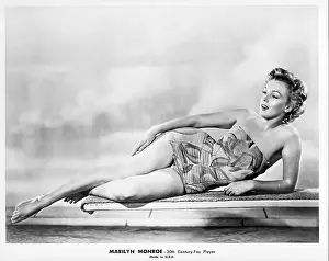 Prints of CIRCA 1956: Actress Marilyn Monroe poses for a portrait reclining on a diving board wearing a bathing suit in circa 1956. (Photo by Michael Ochs Archives/Getty Images) Marilyn Monroe: The Eternal Star Prints: Marylin Reclining