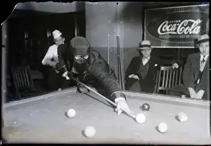 Masked Man Taking A Pool Shot