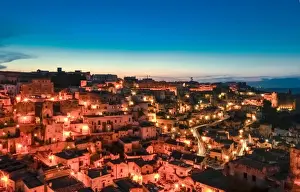 Matera Prints: Matera skyline illuminated at dusk, a UNESCO heritage site