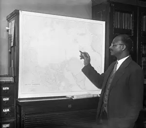 Matt Henson Looking At A Map