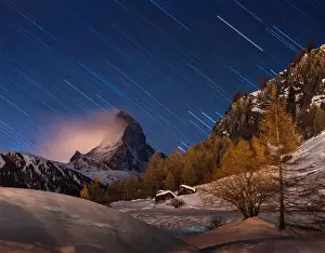 Prints of Night view with star trail in sky The Matterhorn, The Jewel Of The Swiss Alps Prints: Matterhorn with star trail