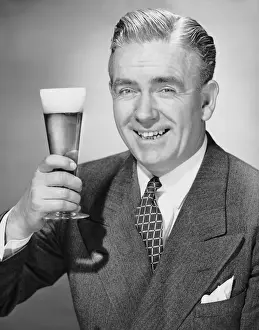 Mature businessman w / beer