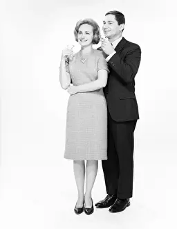 Cocktail Prints: Mature couple drinking cocktails, studio shot