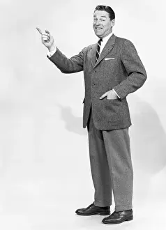 55 59 Years Prints: Mature man gesturing in studio, portrait