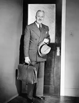 50 59 Years Prints: Mature man posing at doors, about living home, (B&W), portrait