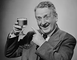 Mature man w / glass of beer