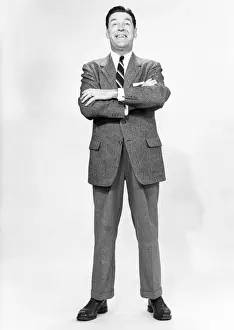 55 59 Years Prints: Mature man wearing suit, standing in studio, portrait