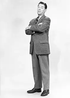 55 59 Years Prints: Mature man wearing suit, standing in studio, portrait