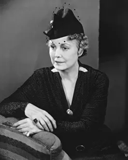 Brooch Prints: Mature woman in fancy hat posing in studio (B&W), portrait