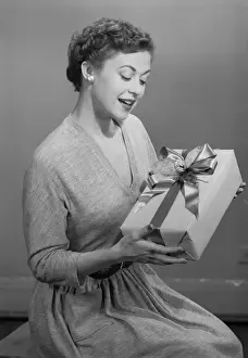 Ribbon Sewing Item Prints: Mature woman holding gift box