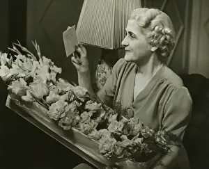 Wavy Hair Prints: Mature woman receiving box of flowers, (B&W)