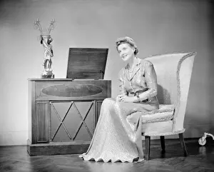 Mature woman sitting on chair, portrait