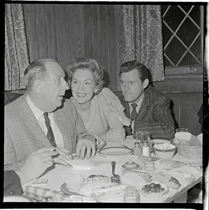 Maureen O'Sullivan Sitting at Table with Admirers
