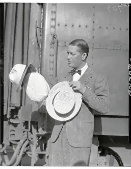 Decisive Prints: Maurice Chevalier Posing with Hats by Train Car