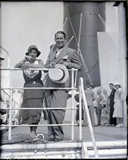 Maurice Chevalier and Wife Leaning on Rail