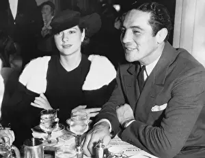 Max Baer and Wife at Table with Drinks
