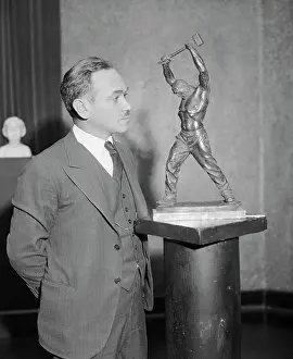 Max Kalish Posing with Statue