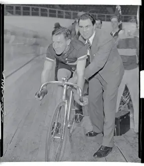 Max Schmeling Assisting Bike Rider