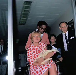 May Britt Holding Her Newborn Daughter