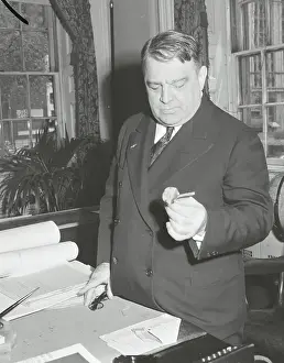 Mayor Fiorello H. La Guardia Gazing at Poppy Flower