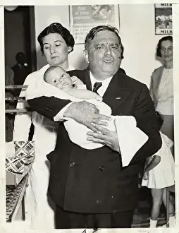 Mayor Fiorello LaGuardia Holding Baby