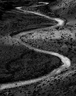 Meandering small creek in black and white