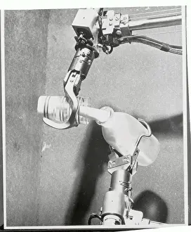 Milk Prints: Mechanical Hands Pouring Milk From a Bottle