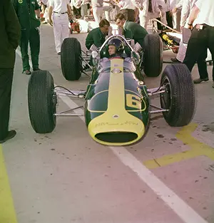 Mechanics Examining Race Car