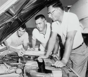 Nascar Prints: Mechanics Inspecting Car of NASCAR Driver Junior Johnson