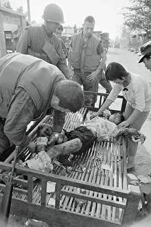 Medic Binding a Child's Wounds