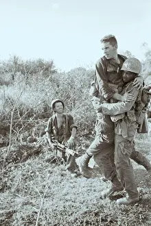 Medic Carries Wounded Marine in Vietnam