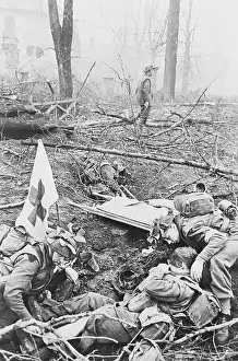 Wound Prints: Medic Helping Injured Soldier in War Torn Area
