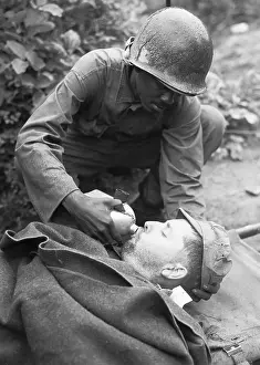 Canteen Prints: Medic Lowers Canteen To Lips Of Soldier