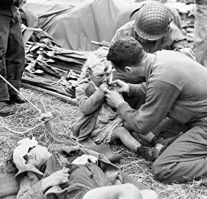 Injury Prints: Medical Corpsman Gives Injured Child Candy