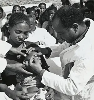Offspring Prints: Medical Personnel Examining Young Child