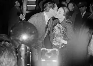 Mel Ferrer Kissing Audrey Hepburn at Airport