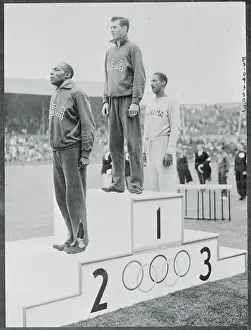 Mel Patton Standing in First Place on Rostrum